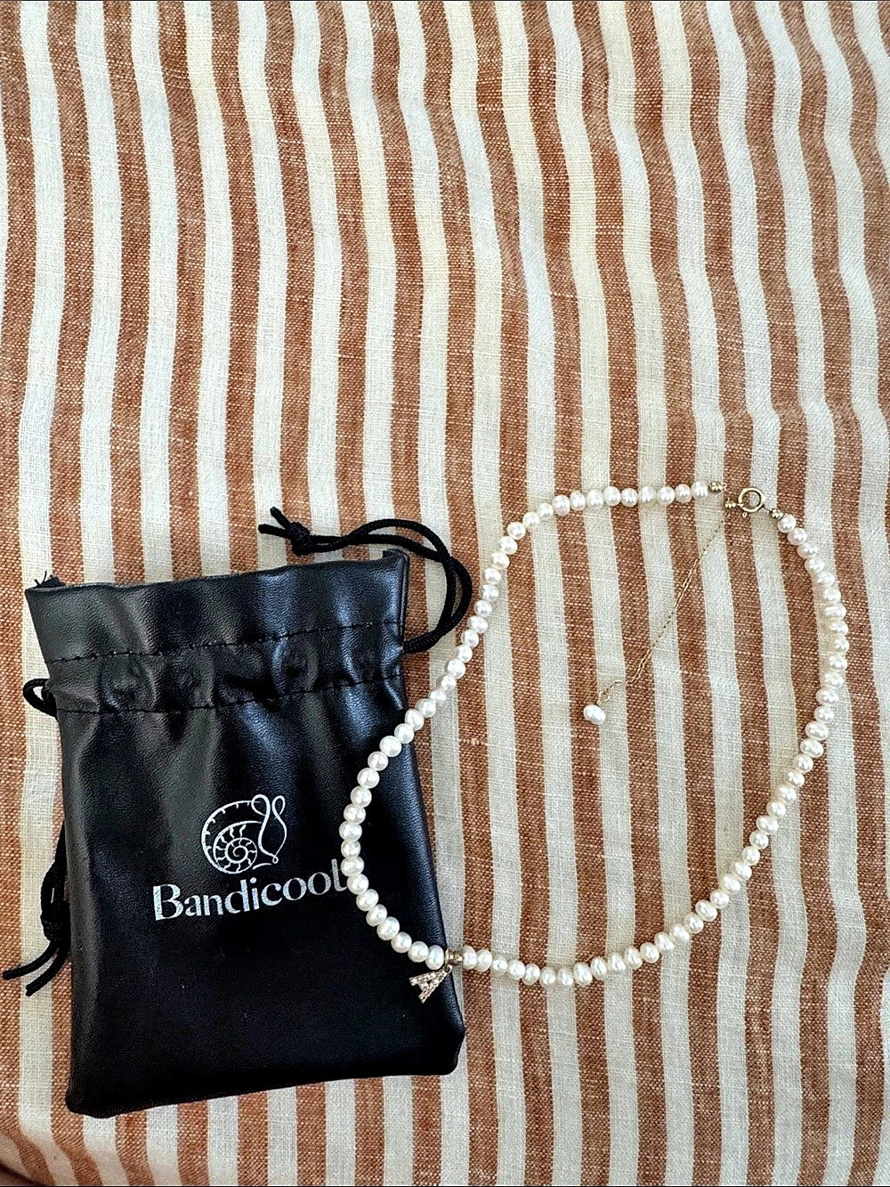Bandicoot By Brinkley Davies  Pearl Strand Necklace with Letter A Pendant